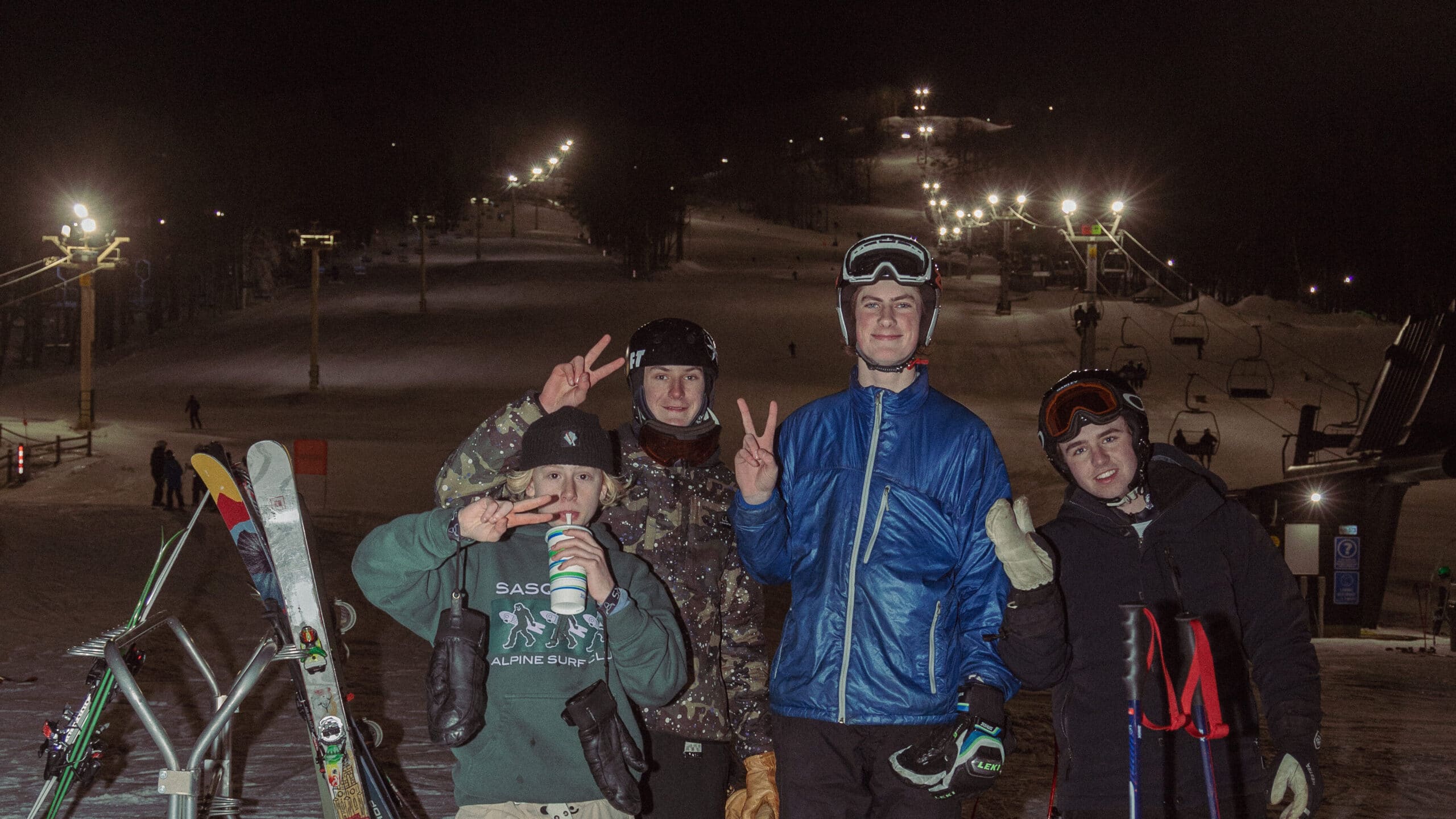 Ski and Snowboards at the foot of Bousquet Mountain at night