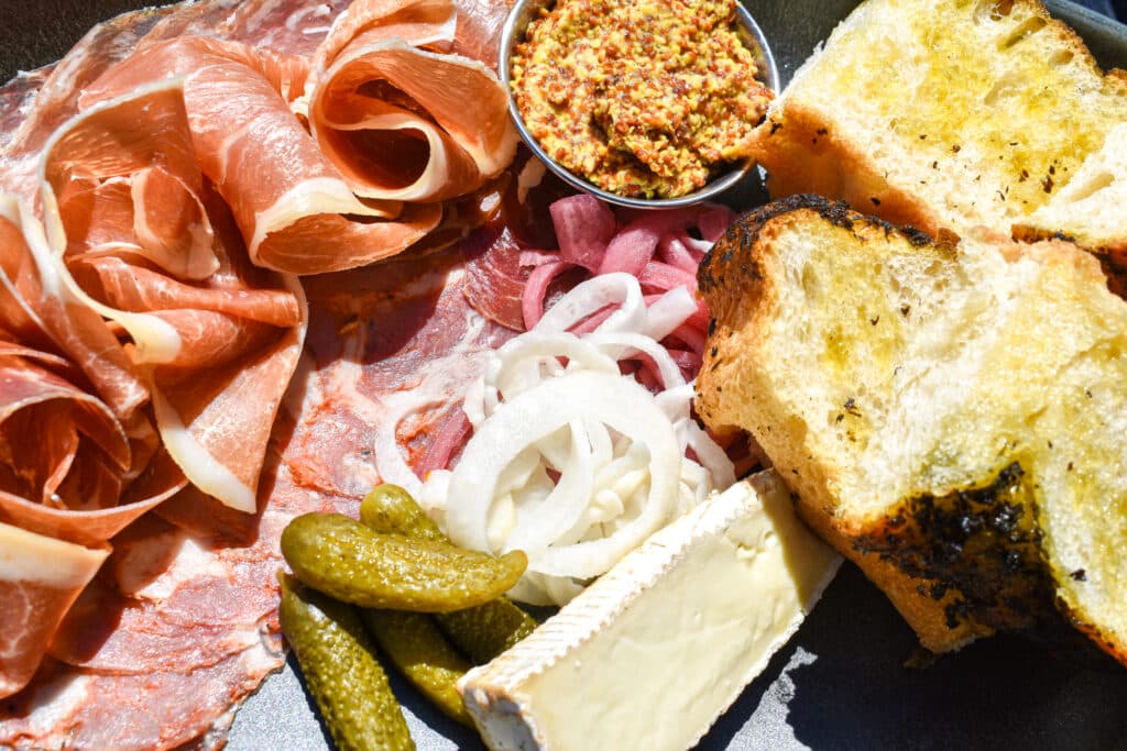 Charcuterie board with a variety of snacks